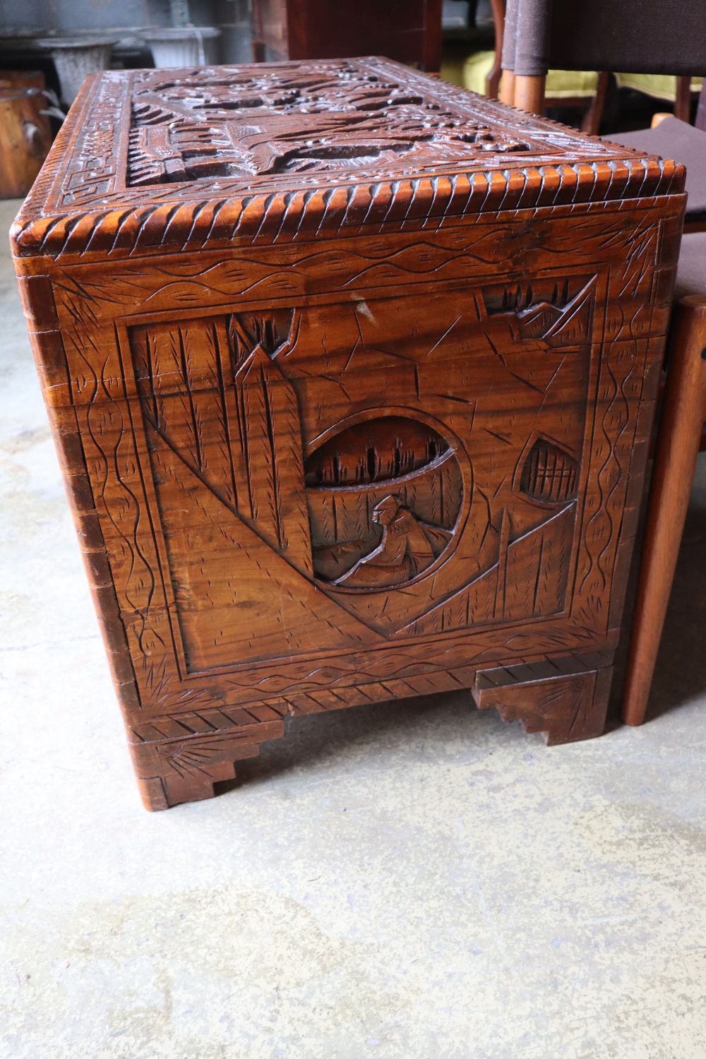 A Chinese carved camphorwood trunk, width 100cm depth 50cm height 58cm